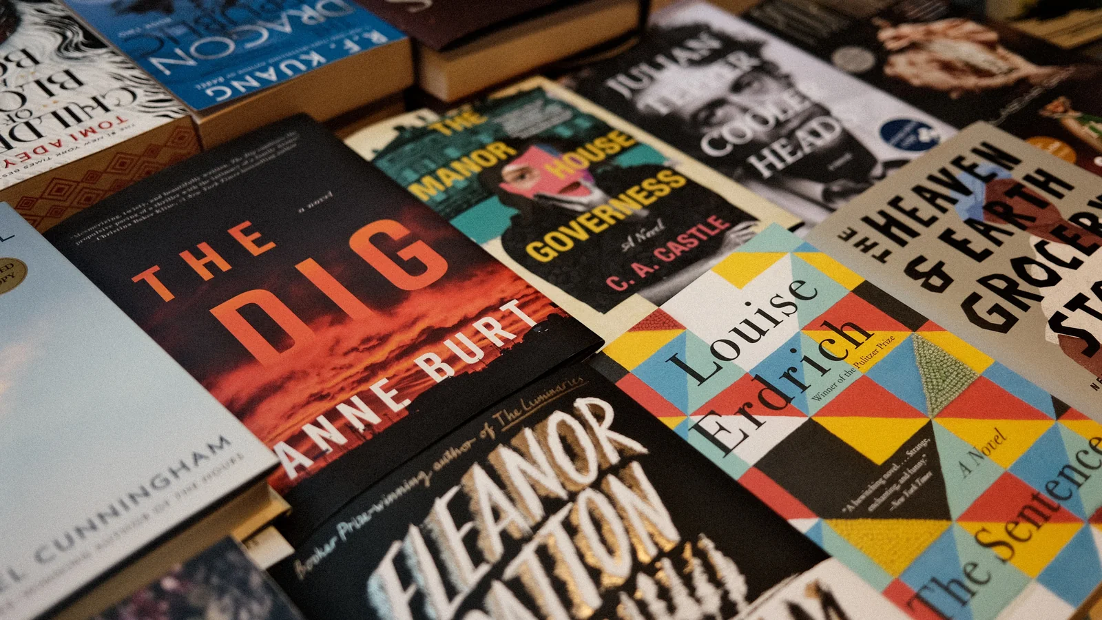 A display of colorful book covers in different genres on a table