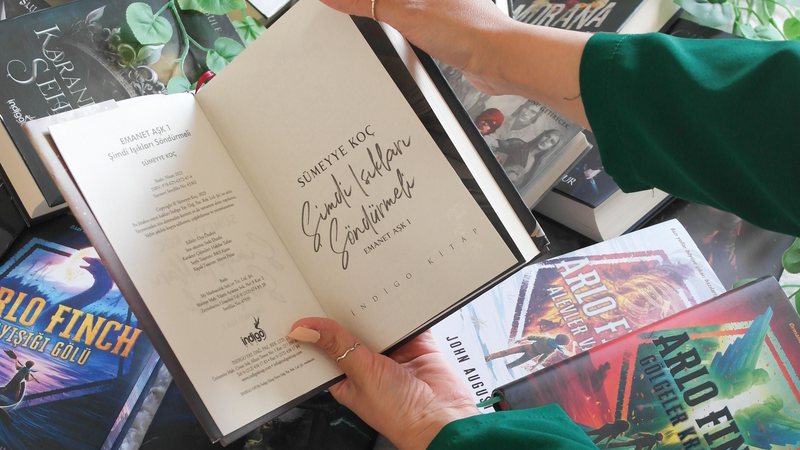 A hardcover book with a dust jacket, representing hardcover format options