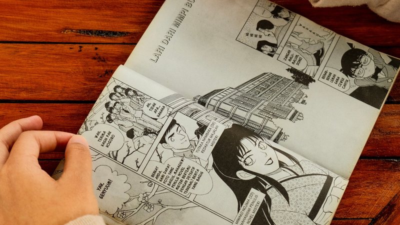An open book with text on the page, representing formatting dialogue in fiction
